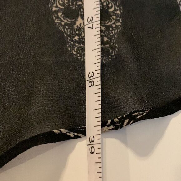 H&m black sugar skull hi low skirt. Elastic waist size four. NWOT. - Picture 10 of 10